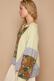 MQTIME  -  Exposed Seam Printed Notched Raglan Sleeve Knit Top