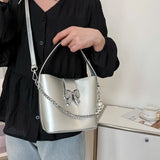 MQTIME  -  Spring/Summer 2024 new, solid color PU women's shoulder bag, silver bow decoration, fashion trend