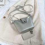 MQTIME  -  Spring/Summer 2024 new, solid color PU women's shoulder bag, silver bow decoration, fashion trend